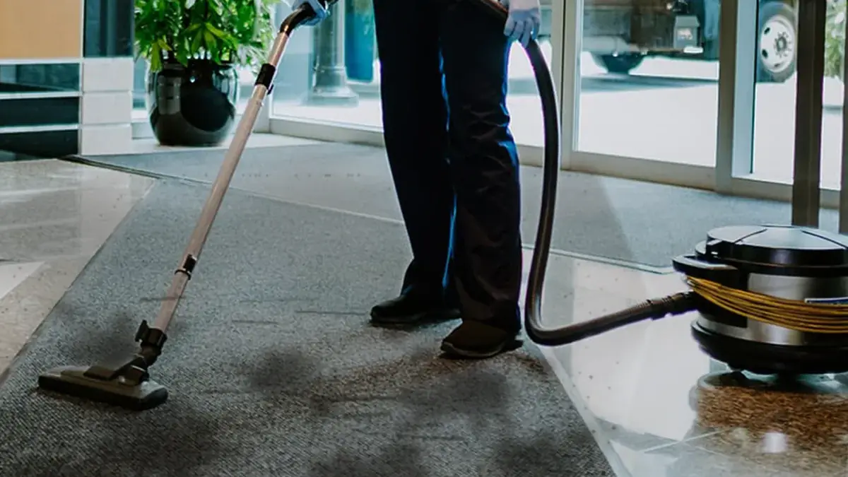 Entry carpet and lobby floor with ground-in soiling and staining